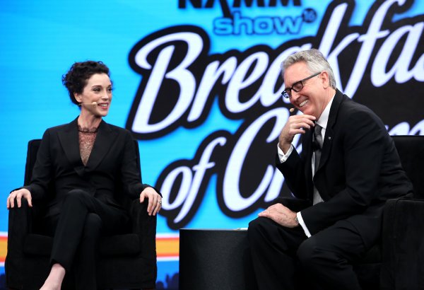 Annie Clark a.k.a St. Vincent and NAMM President and CEO Joe Lamond speak on stage at the 2016 NAMM Show Opening Day at the Anaheim Convention Center on January 21, 2016 in Anaheim, California. (Photo by Jesse Grant/Getty Images for NAMM)